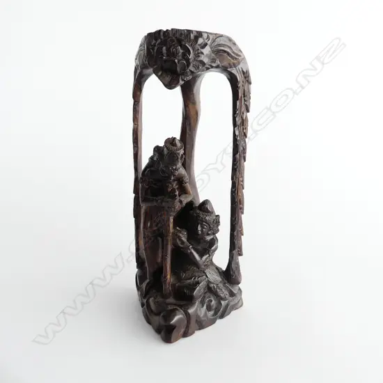 INDONESIAN CARVING OF TWO FIGURES SHELTERING UNDER A TREE.H 28CM