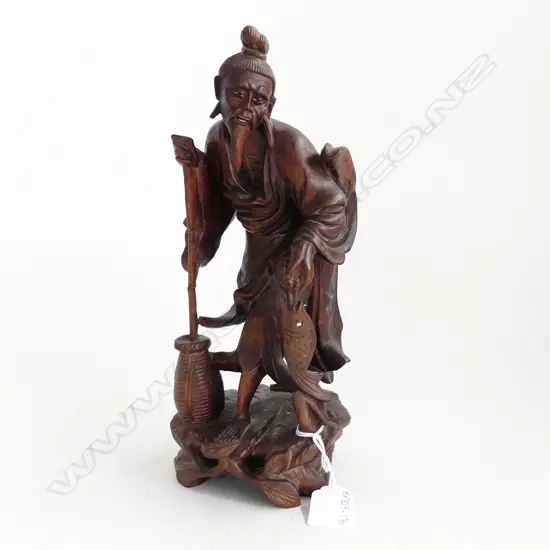 CHINESE CARVED WOOD FISHERMAN CARRYING FISH. H 27.5CM.