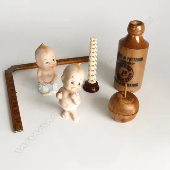 6 ITEMS IN BOX. 2 PORCELAIN KEWPIE STONE  GINGER BEER RULER BONE ELEPHANTS & WOODEN APPLE.