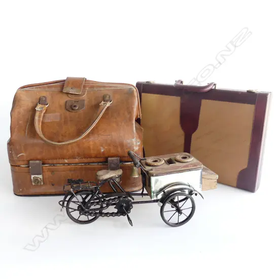3 BOXED ITEMS. OLD SUITCASE BACKGAMMON SET AND REPRO SALESMANS TRIKE. 