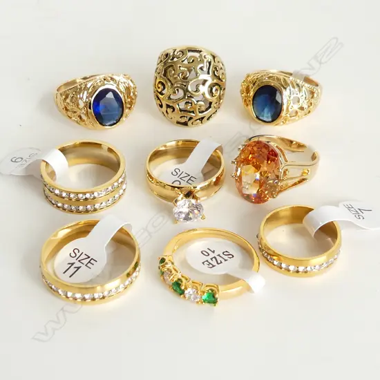 9 GOLD TONE COSTUME RINGS