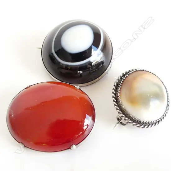 3 LG SILVER MOUNTED BROOCHES; CATS EYE (SEA SNAIL), CARNELIAN