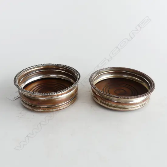 TWO ANTIQUE SILVER ON COPPER BOTTLE DECANTER COASTERS WITH GADROONED RIM & WOODEN BASES D. 135mm