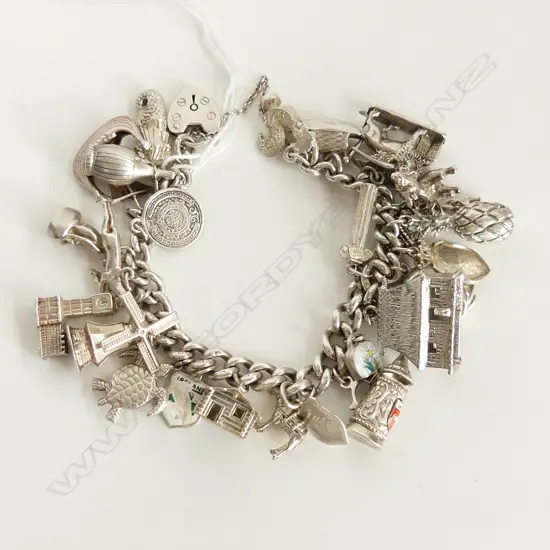 SILVER CHARM BRACELET LOADED WITH VARIOUS CHARMS 112gms
