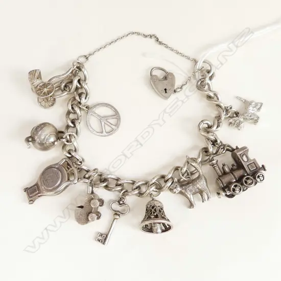 STG SILVER CHARM BRACELET 56 GRAMS