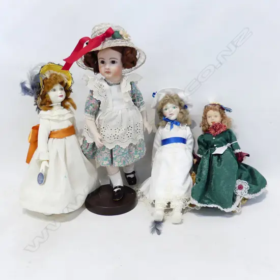 4 MODERN  PORCELAIN HEADED DOLLS. 