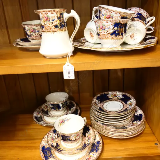 PORCELAIN 9 PLACE ENGLISH TEASET. CUPS SAUCERS PLATES JUG & CAKE PLATE.ONE CUP HANDLE GLUED. 