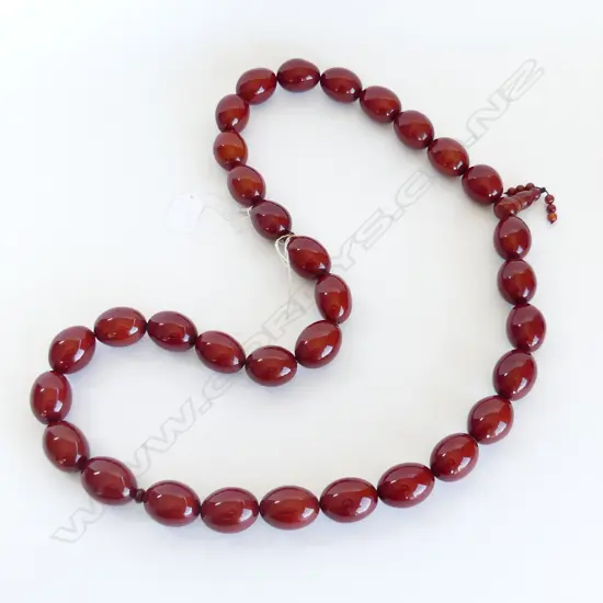 STRAND X LARGE AMBER COLOURED BEADS, 671GMS 