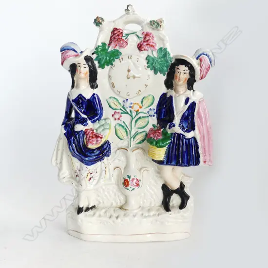 19thC STAFFORDSHIRE FLATBACK, FRUITSELLERS WITH CLOCK. H.310mm