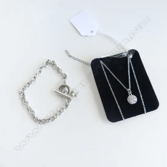 FAUX  SOLITAIRE DIAMOND ON SILVER TONE CHAIN & FOB BRACELET WITH STAR CHARM
