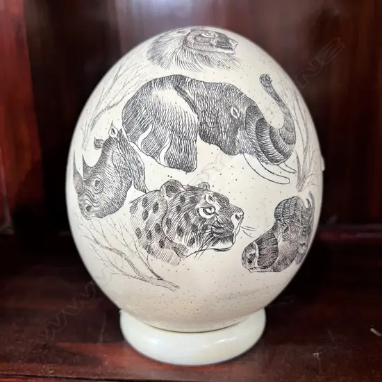 SCRIMSHAW OSTRICH EGG ON UNASSOCIATED STAND. H.160mm...