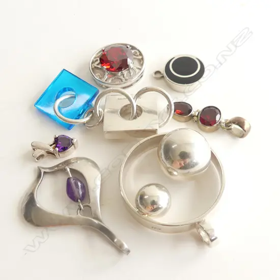 7 ASST 1970'S STYLE SILVER PENDANTS 