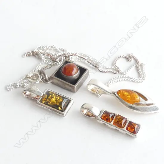 4 ASST STG SILVER SET AMBER PENDANTS, 1 WITH CHAIN 