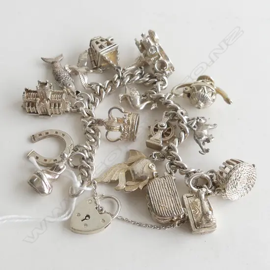 STG BRACELET w. 17 ASST. CHARMS 82 GRAMS