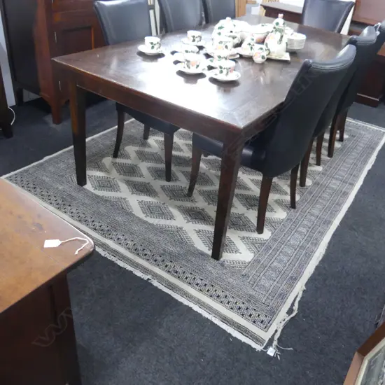 PAKISTANI BOKHARA HANDKNOTTED WOOL PILE RUG; many medallions on pale ivory ground 1800x2700mm some edges worn