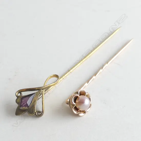 2 STICK PINS; 1 AMETHYST 1.5GMS & 1 PEARL 2.1GMS