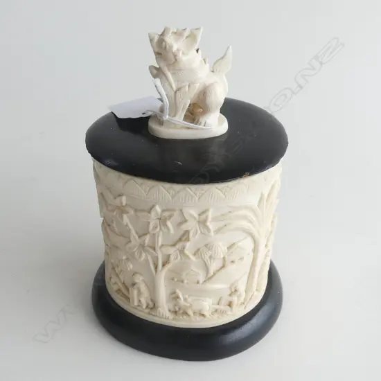 VILLAGE SCENE CARVED IVORY BOX WITH MOUNTED FOO DOG ON LID H. 150MM (CRACK TO SIDE OF BOX)