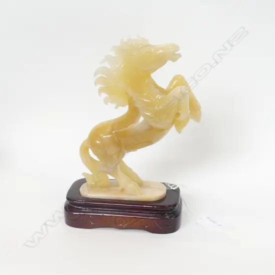 ORIENTAL CARVED QUARTZ STALLION ON WOODEN STAND H. 250MM