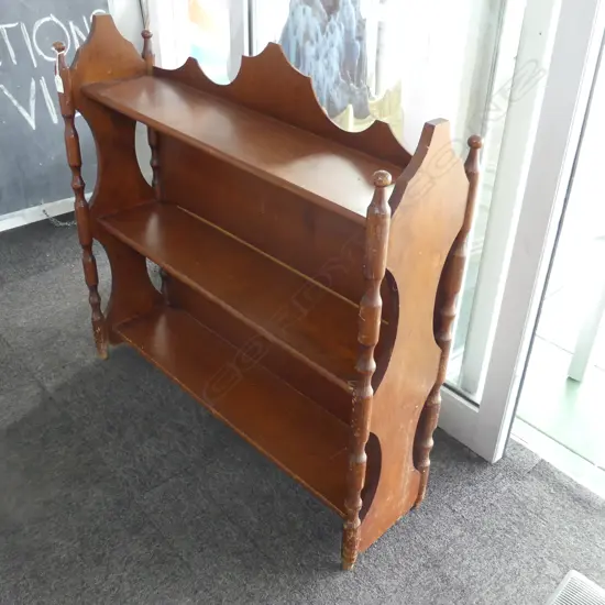 FREESTANDING COLONIAL KAURI 3 TIER SHELF. 4 TURNED SUPPORTS SUPPORTING WAISTED SIDES AND A SCALLOPED BACK .H.875mm