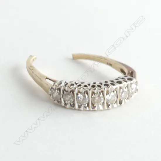 9CT GOLD RING SET WITH 7 DIAMONDS - BAND HAS BEEN CUT 2.98GMS