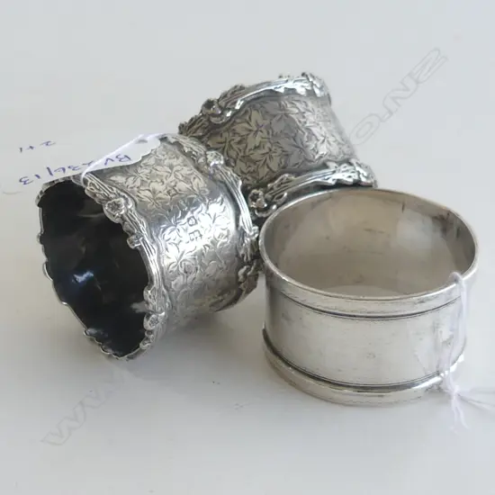 PR OF S/S NAPKIN RINGS& 1 PLAIN S/S NAPKIN RING