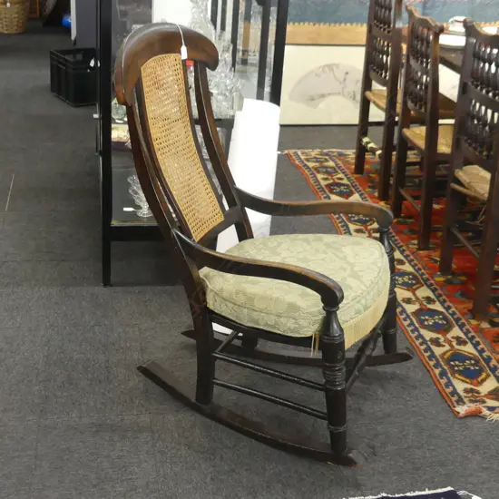 EBONISED EARLY 19THC ROCKING CHAIR NOT ORGINAL CANE SEAT