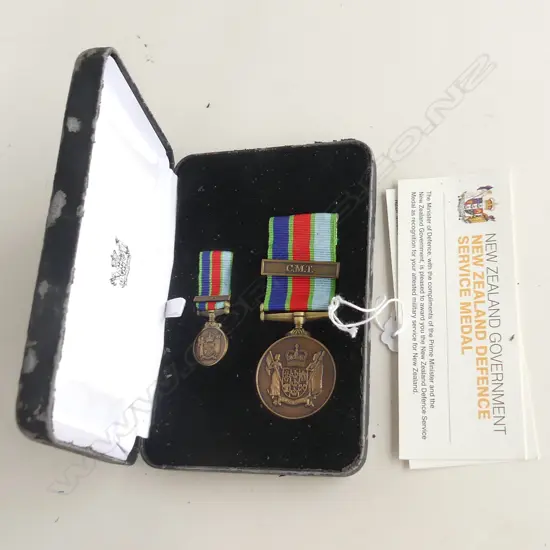 'THE NEW ZEALAND DEFENCE MEDAL' W MINIATURE THE BOX SHOWING WEAR