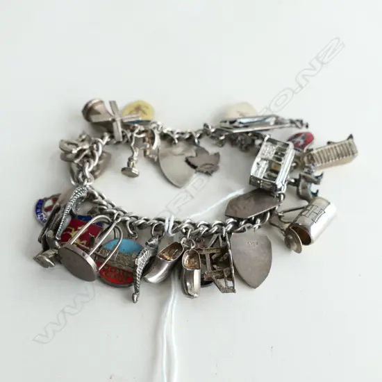 STG SILVER CHARM BRACELET WITH PADLOCK & 27 CHARMS 66.23GMS