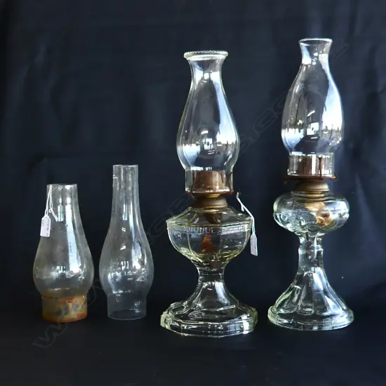 2 EDAWRDIAN CLEAR GLASS KEROSENE LAMPS W 2 EXTRA GLASS CHIMNEYS.