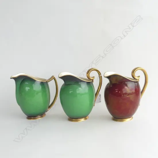 3 CARLTON WARE JUGS; 2 VERT ROYAL & 1 ROUGE ROYAL, ALL WITH GOLD GILDED HANDLS H. 160MM