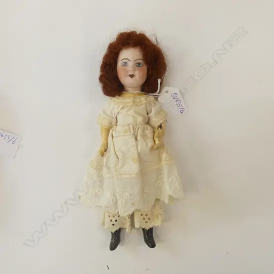 VINTAGE SMALL PORCELIAN DOLL WITH RED WIG