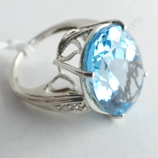 STERLING SILVER AND 15.76CT BLUE TOPAZ DRESS RING (AIG REPORT)
