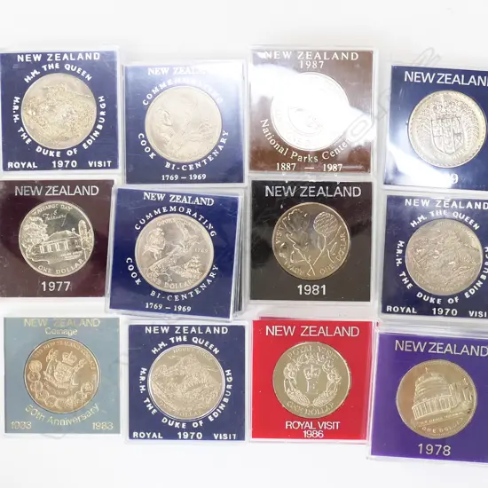 21 ASST. NZ COMMEMORATIVE COINS IN WOODEN BOX W.160mm