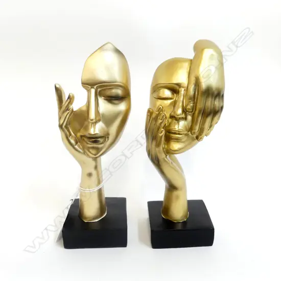 PR STATUETTES, GOLD FACE IN HANDS ON WOOD STANDS