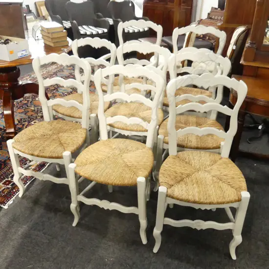 8 PAINTED LADDER BACK DINING CHAIRS; RUSH SEATS, 2 CARVERS