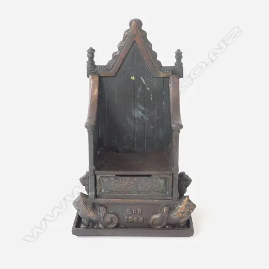 CAST IRON MONEYBANK WITH 'BRONZED' FINISH AS A THRONE, 1953 MAKER 'HARPER' 120X65X200mm.