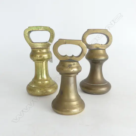 THREE OLD SOLID BRASS BELL WEIGHTS, TWO 180 ONE 150mm HIGH.