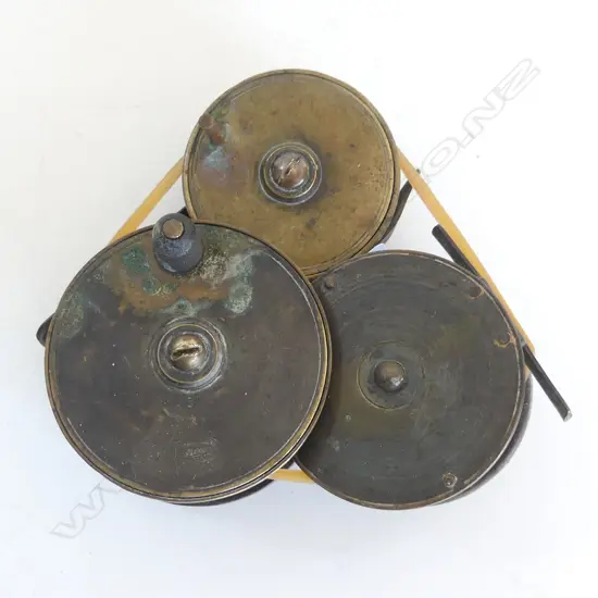 THREE BRASS OLD FISHING REELS , TWO MARKED ALLCOCKS