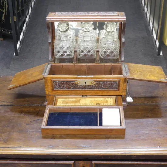 EARLY 20thC OAK TANTALUS w. HIDDEN GAMES DRAWER 360x270x340mm