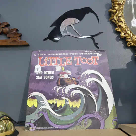 LASER CUT HUIA  FROM OLD RECORD WITH RECORD COVER( LITTLE TOOT) L 260MM