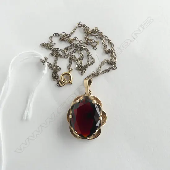 9CT GOLD GARNET PENDANT 4.9gms on plated CHAIN