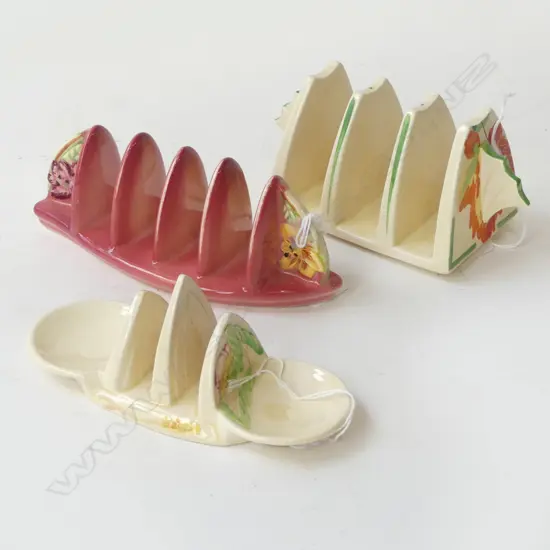 THREE ENGLISH CHINA DECO SHAPES TOAST RACK, L.170mm