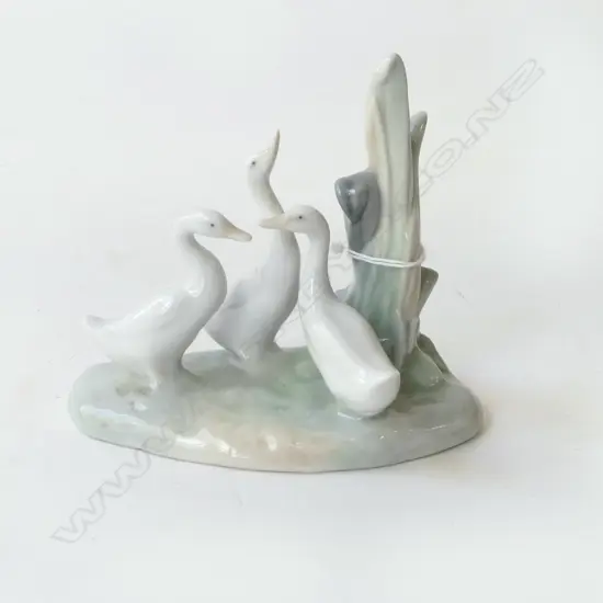 REX CHINA  FIGURINE OF A BOY WITH A HURT FOOT, H.190mm & NAO DUCK ?, H.120mm