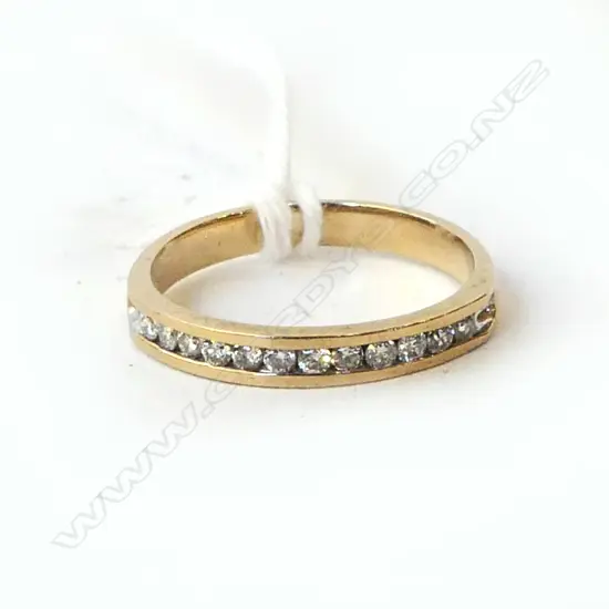 9CT GOLD AND DIAMOND SET BAND SIZE L  1.8 GMS