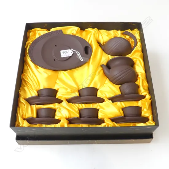 BOXED CHINESE YIXING DARK TERRACOTTA TEA SERVICE. 2 pots + stand + 6 cups & saucers 