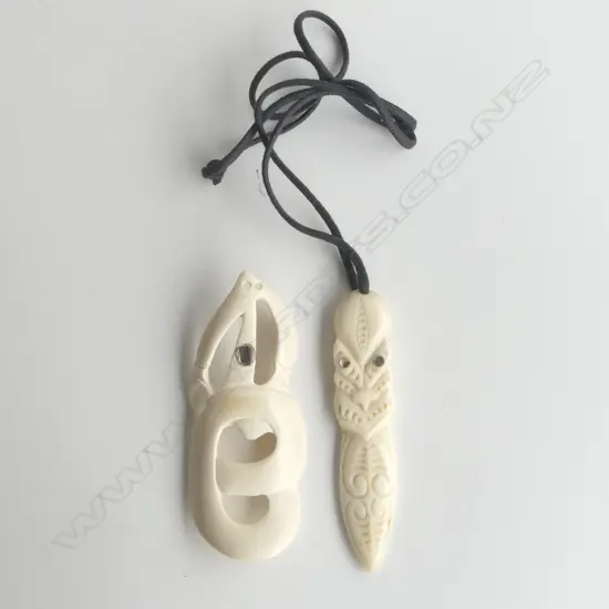 2 CONTEMPORARY MAORI CARVED BONE PENDANTS. Mask w tongue extended + manaia type L's.90mm.