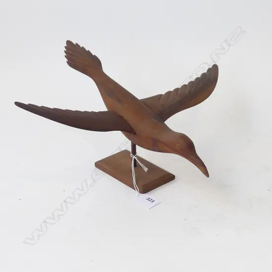 PITCAIRN CARVED WOODEN BIRD ON STAND W.340mm signed to base