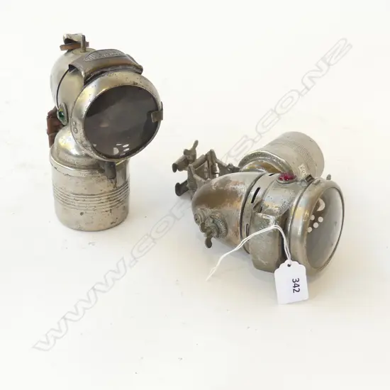 TWO ANTIQUE CARBIDE CYCLE LAMPS ‘OBERMETALL’ AND ‘RIEMANN’, H.170MM