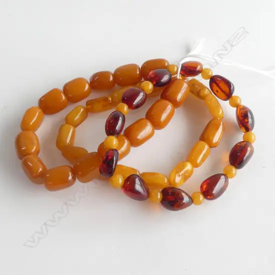 THREE AMBER BRACELETS, NEW OLD STOCK 