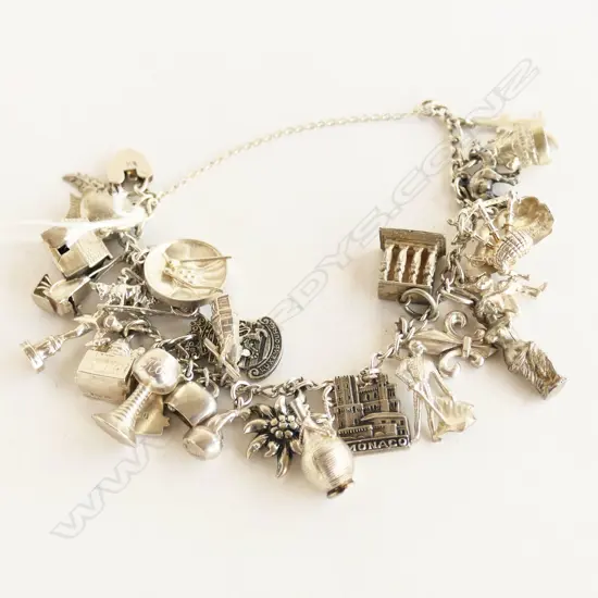SILVER HEAVY MULTI CHARM BRACELET 63gms